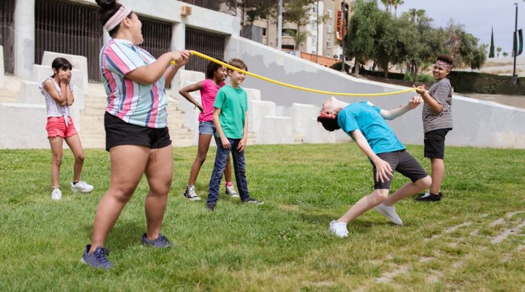 A Boy Bending Her Body Under the Rope