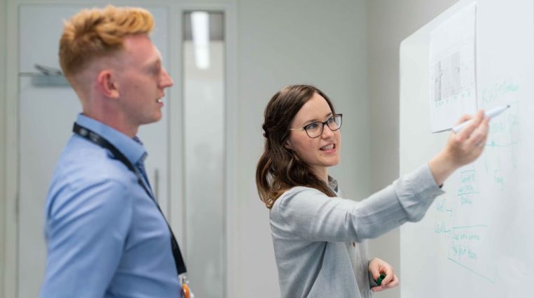 Female Engineer Holding Presentation