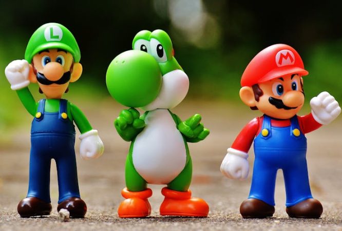 Focus Photo of Super Mario, Luigi, and Yoshi Figurines