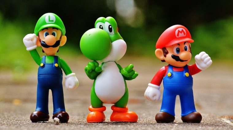 Focus Photo of Super Mario, Luigi, and Yoshi Figurines