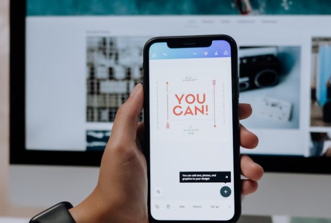 Holding a Smartphone in front of an Imac