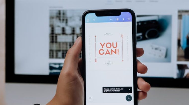 Holding a Smartphone in front of an Imac