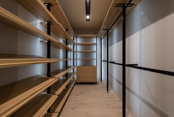 Interior of wardrobe with wooden shelves