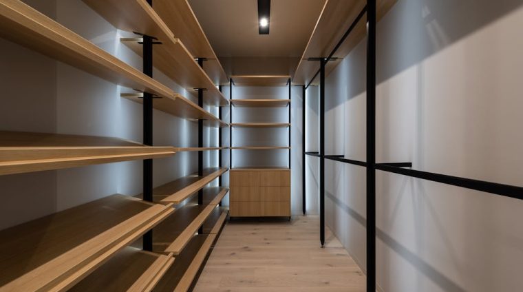 Interior of wardrobe with wooden shelves