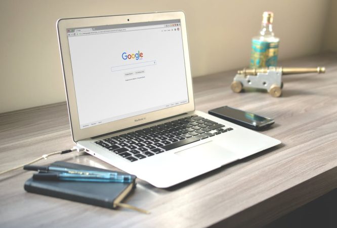 Macbook Air on Grey Wooden Table