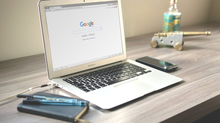 Macbook Air on Grey Wooden Table