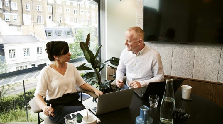 Man and Woman Discussing And Sharing Ideas