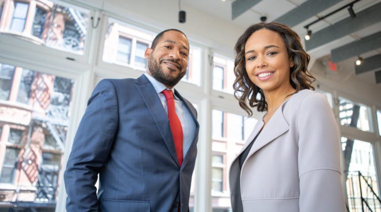 Man and Woman Smiling Inside Building