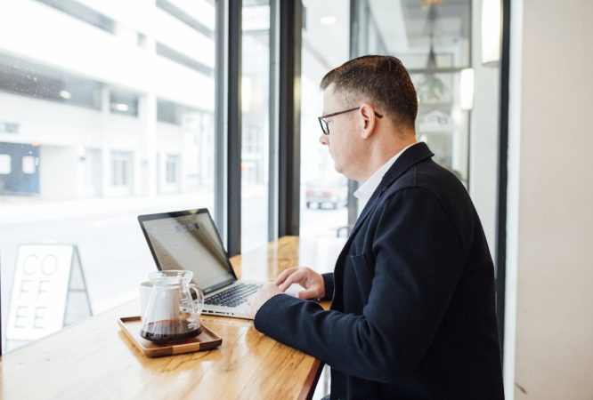 Man Using his Laptop Computer