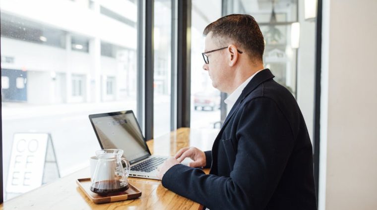 Man Using his Laptop Computer