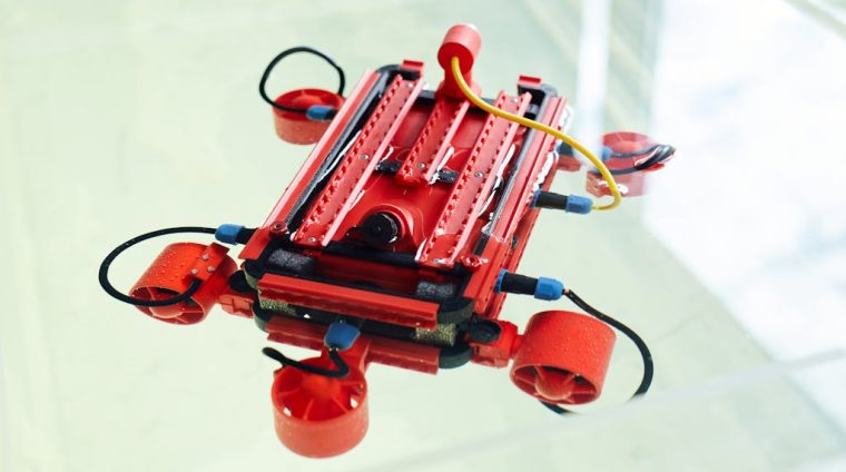 Robot made with 3d printer with cables and wires against white background