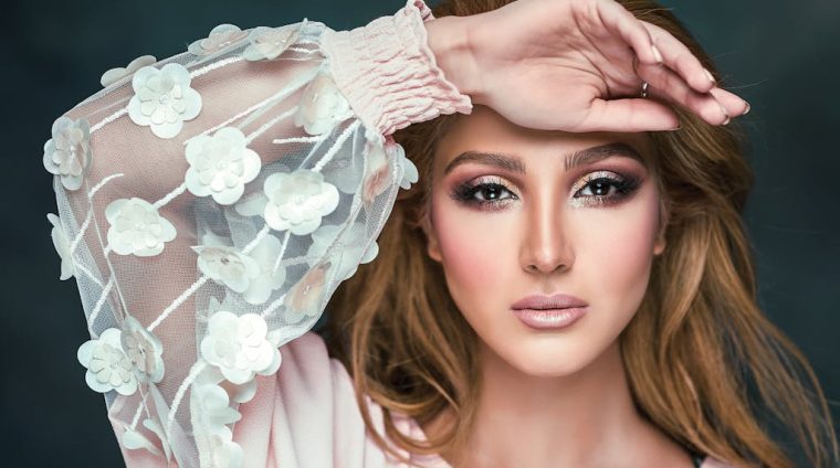 Woman Wearing Floral Long-sleeved Shirt Covering Her Forehead